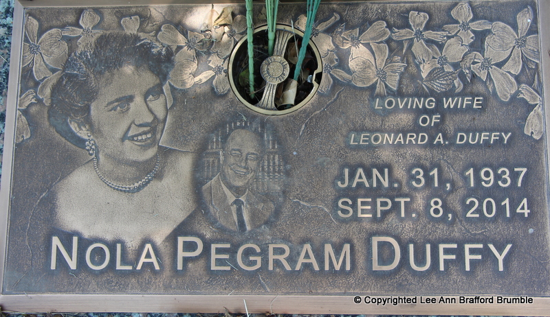 The grave marker of Nola Pegram Duffy, bearing etched portraits of Nola and
her husband Leonard A. Duffy